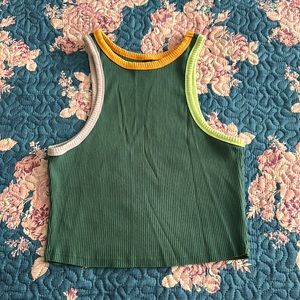 This is a Green cropped tank top with purple, orange and like green outline.